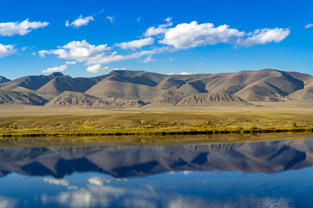 Beautiful lake in the mountains, the reflection of the mountains in the waterの写真素材