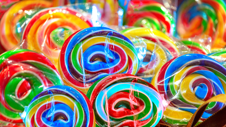 Colorful Colorful lollipop swirl, background from delicious multicolored candyの写真素材