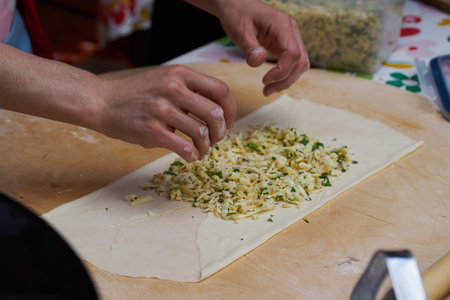 preparations Turkish traditional dish -flatbread with herds and cheese. Gozleme