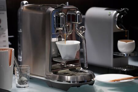 coffee preparation. chrome coffee machine. two coffe machinesの写真素材