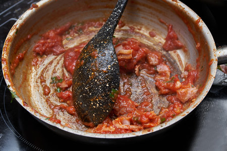 Cooking sauce for pasta in frying pan. close up photo
