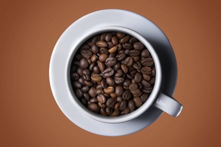 Coffee cup with roasted beans on brown background. Top viewの写真素材