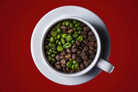 Coffee cup with raw and roasted beans on red background. yin-yang. Top view. coffee in the form of Yin Yang top viewの写真素材