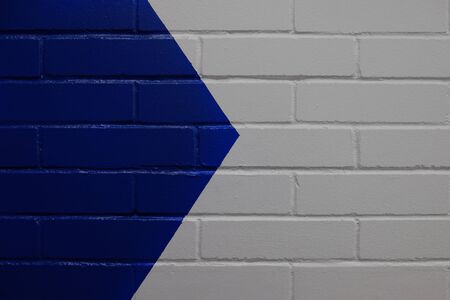 Directional arrow on a wall on the right.の写真素材