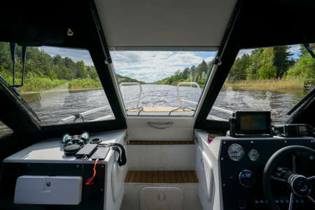 View from the cabin of the boat on the river in summerの写真素材