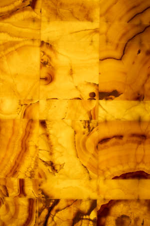 Honey onyx, decorative stone wall panel, background photo textureの写真素材