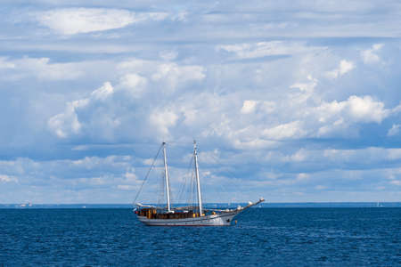 Old ship with two masts with lowered sailsの写真素材