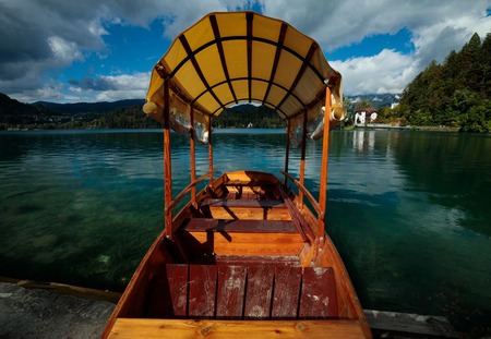wooden boat at lake bled in the summerの写真素材