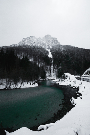 river and asphalt mountain road. Winter Landscapes in lower Austriaの写真素材