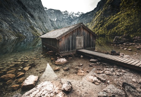 Boat dock hangar on Obersee mountain lake in Alps. Bavaria, Germanyの写真素材