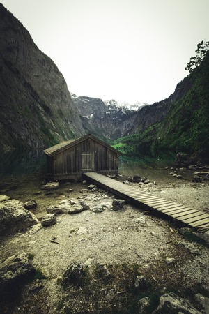 Boat dock hangar on Obersee mountain lake in Alps. Bavaria, Germanyの写真素材