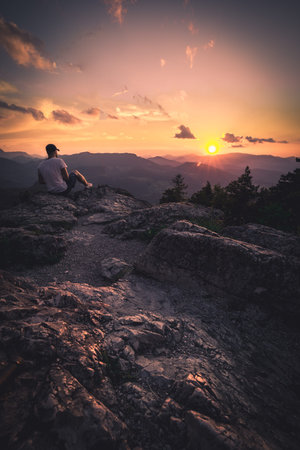 Man on top of mountain. Conceptual scene.