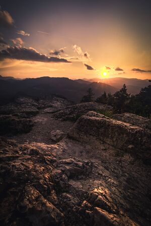 rock on the mountain top at sunset.の写真素材