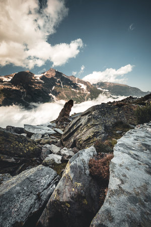 alpine landscape with peaks covered by snow and clouds in the alps in austria