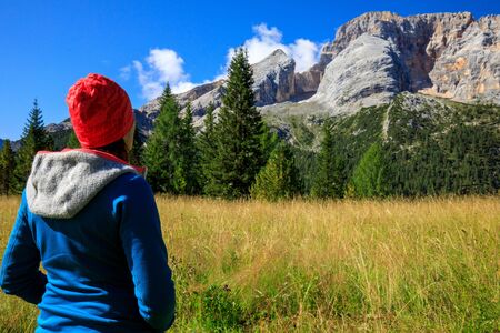 hiker girl in the mountains relaxing and enjoying the view during autumnの写真素材
