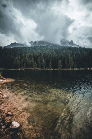 rainy day on lago di misurina in the dolomites in italy during autumnの写真素材