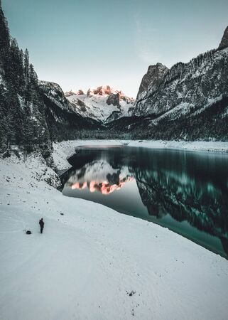 mountain lake in Winter with Reflection during Sunset in Austriaの写真素材