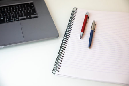 business table with notebook and pen background and copy space