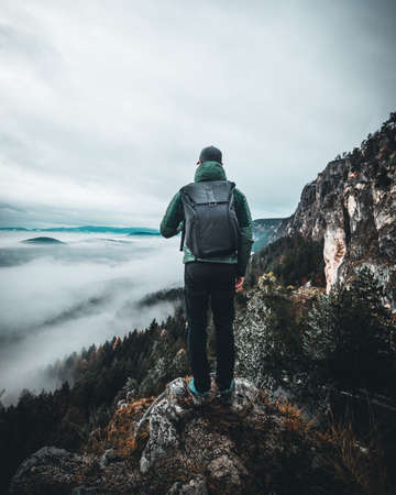 Man on top of the mountain. Conceptual scene. Man enjoying Sunset on the Peakの写真素材