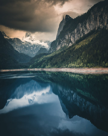 Alpine lake with dramatic sky and mountains. heritage site. Gosausee, Tyrol, Austria