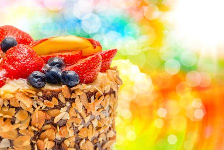 Birthday fruit cake with fruits close upの写真素材