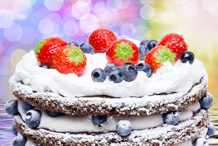 Birthday fruit cake with fruits close upの写真素材