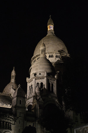 A night view of The Sacred Heart church on the Montmartre hill in Paris Franceの写真素材