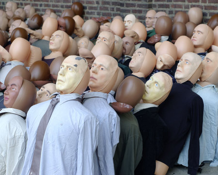 A group of dolls representing a crowd of people.