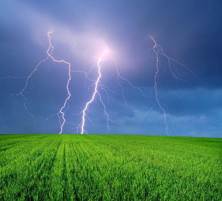 Thunderstorm with Lightning in Green Fieldの写真素材