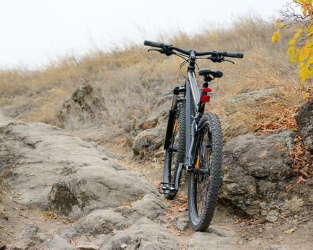 Mountain Bike on the Beautiful Autumn Rocky Trail. Active Lifestyle and Extreme Sports Concept.の写真素材