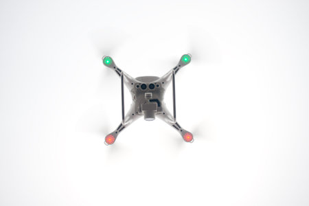 White Drone with Camera Flying in Blue Sky. UAV Concept