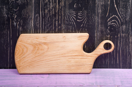 Layout for the leaflet. Free space for text. Cutting Board on wooden purple black horizontal...