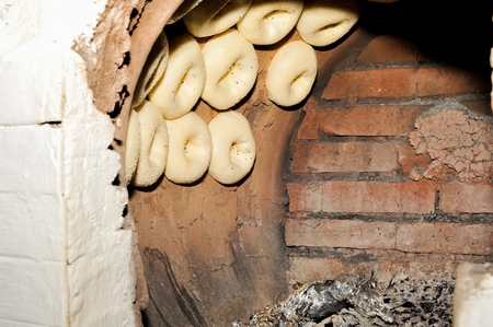 Process of cooking tandoor bread national Uzbek flatbreadの写真素材