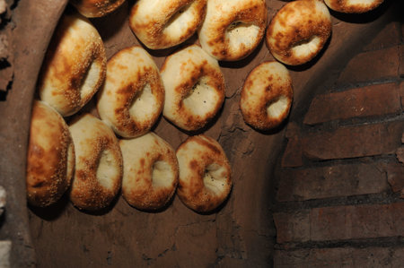 Process of cooking tandoor bread national Uzbek flatbread