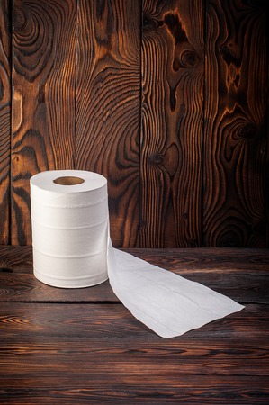 toilet paper on wooden backgroundの写真素材