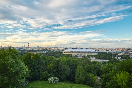 Urban landscape with a sports stadium at sunsetの写真素材