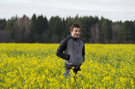 Man stands in the flower fieldの写真素材