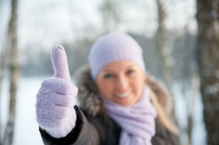 Smiling woman on the background of winter landscapeの写真素材