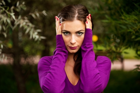 Portrait Of Young Beautiful Woman Near The Treesの写真素材