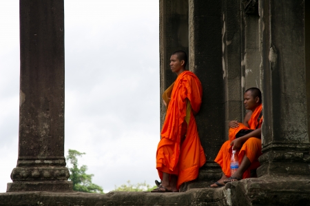 SIEM REAP, CAMBODIA - July 17, 2013  Monk posing in Angkor Wat temple, July 17, 2013, Siem Reap, Cambodia  Buddhism is currently estimated to be the faith of 96  of the Cambodian population のeditorial素材