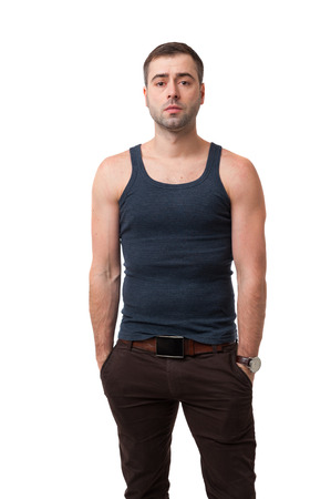 Portrait of smiling Mature man with hands in pockets  isolated on white background. Casual style in t-shirtの写真素材