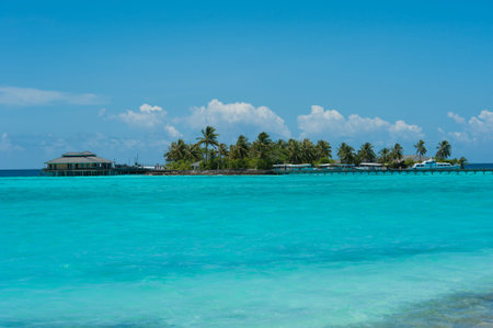 Island with yacht and boats in the ocean, Maldives