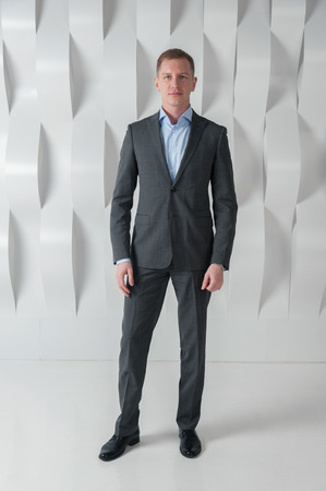 Business man on background of abstract modern urban interiorの写真素材