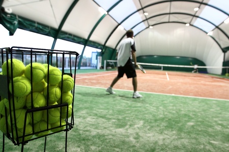 Tennis player on the indoor courtの写真素材