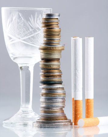 cigarettes and money on tableの写真素材
