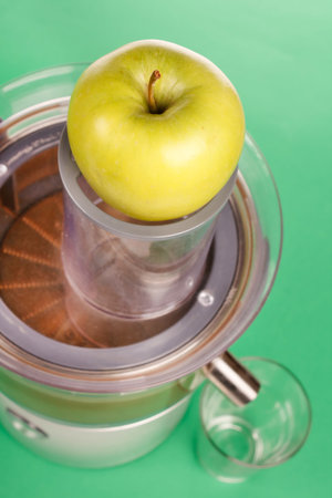 green apple in the juicerの写真素材