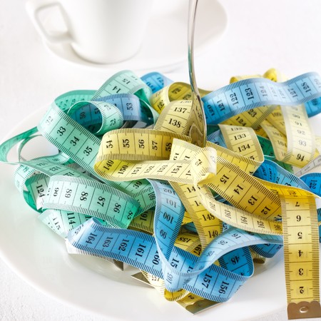 Fork and measuring tape の写真素材