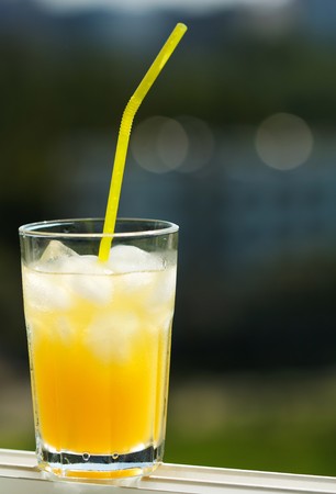 glass of orange juice with ice の写真素材