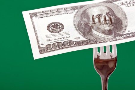 fork with moneyの写真素材