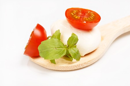 tomatoes with mozzarella and basil の写真素材